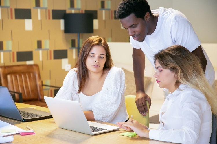 high school students work on computer