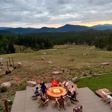 teachers around a firepit