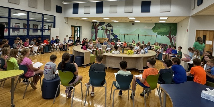 large group of young learners in circle