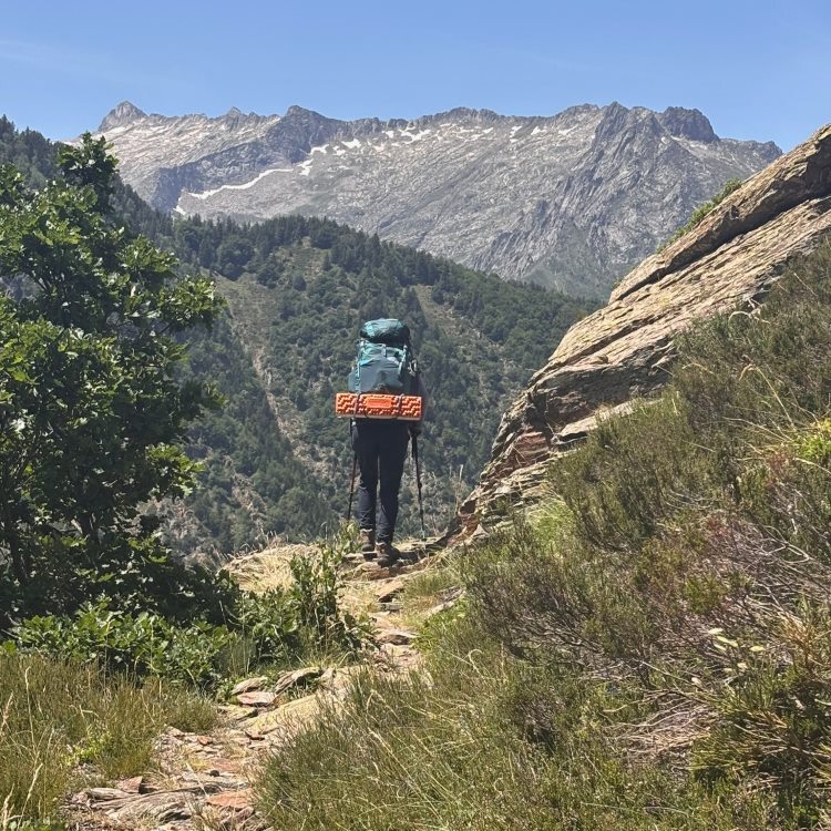 hiker with backback on mountain trail