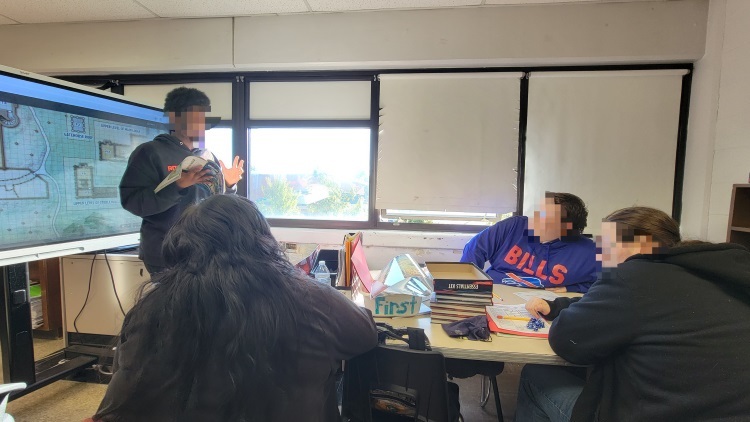 student leading a D&D game in class