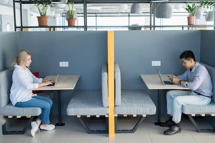 students at separate booths