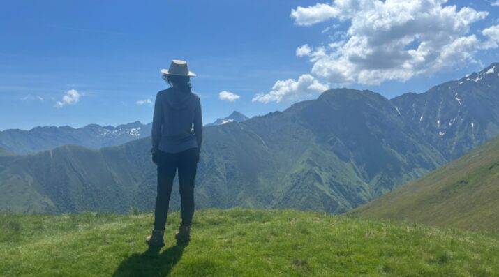 hiker looking at mountains in the distance