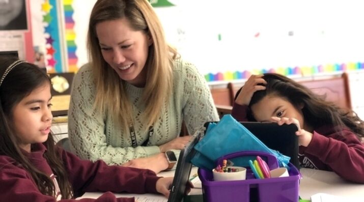 teacher with 2 students