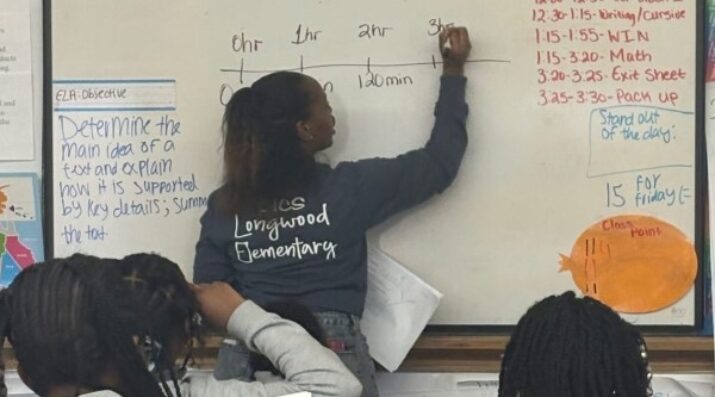 middle school student mathwork at whiteboard