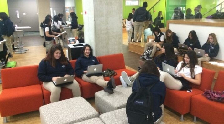 students working on laptops in open interdisciplinary space