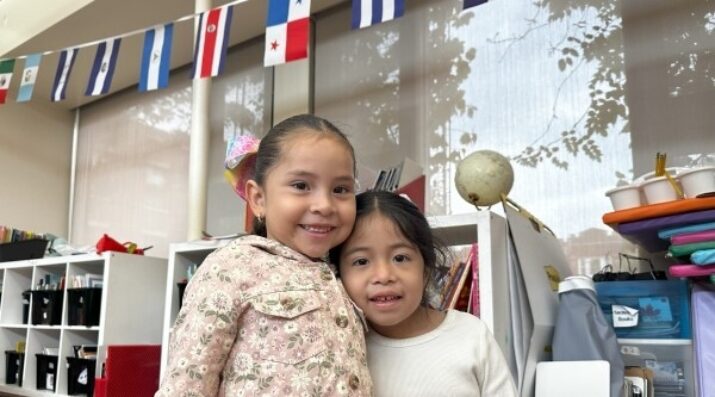 two elementary students smiling
