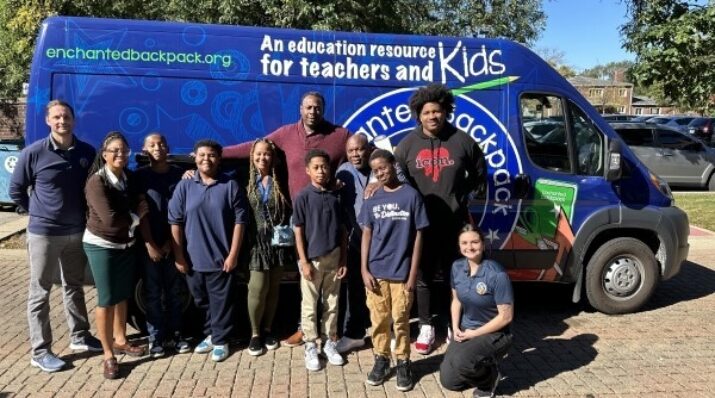 students with community partners and their van