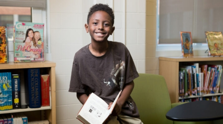 middle schooler with book