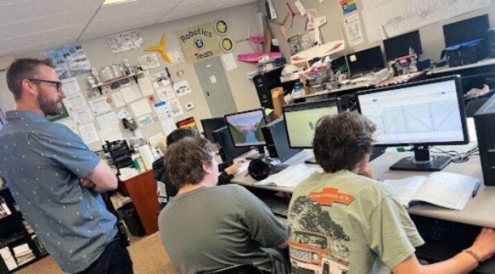 principal with students in tech class