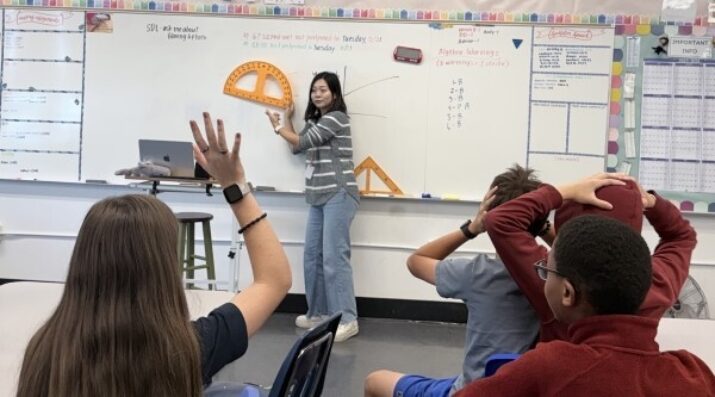 math teacher guiding a lesson