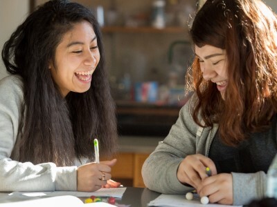 Two female High School students collaborating
