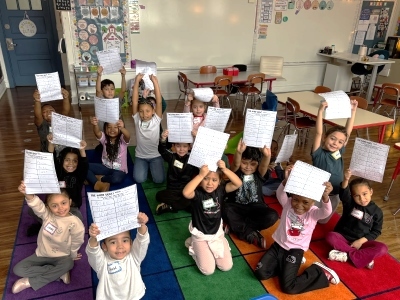 kindergarten students on classroom carpet