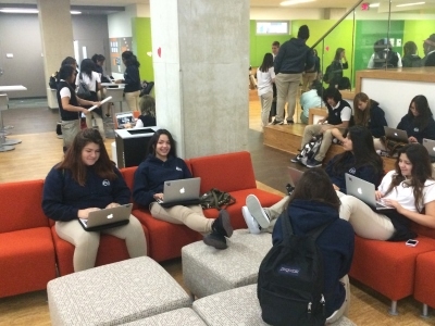 students working on laptops in open interdisciplinary space