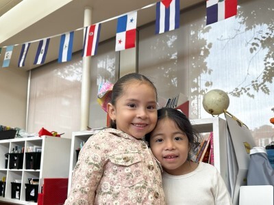 two elementary students smiling