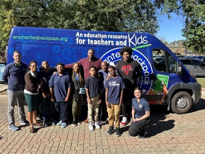 students with community partners and their van