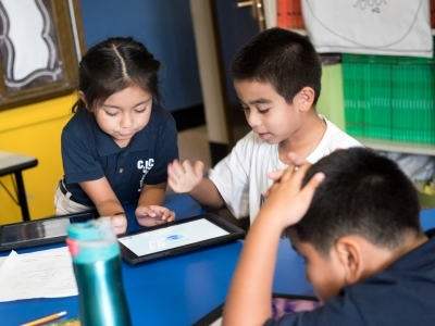 young students work together to solve a problem