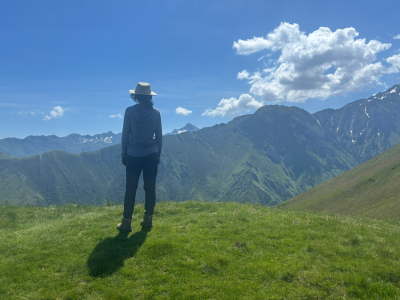 hiker looking at mountains in the distance
