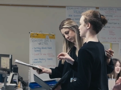 student explaining learning to teacher