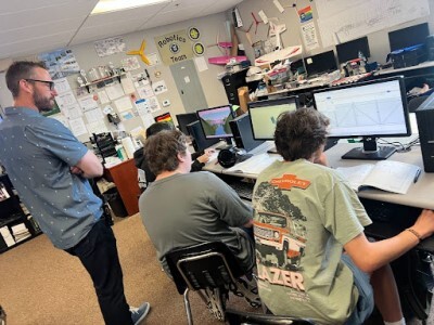 principal with students in tech class