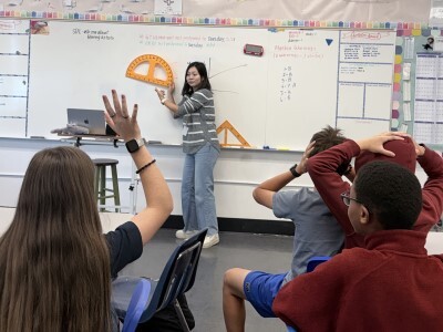 math teacher guiding a lesson