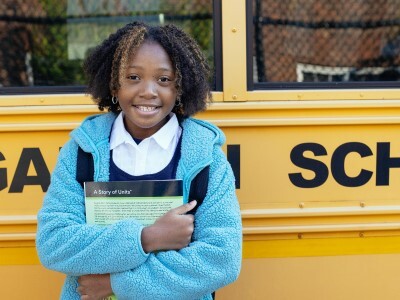 student outside a school bus