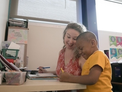 special education teacher and student